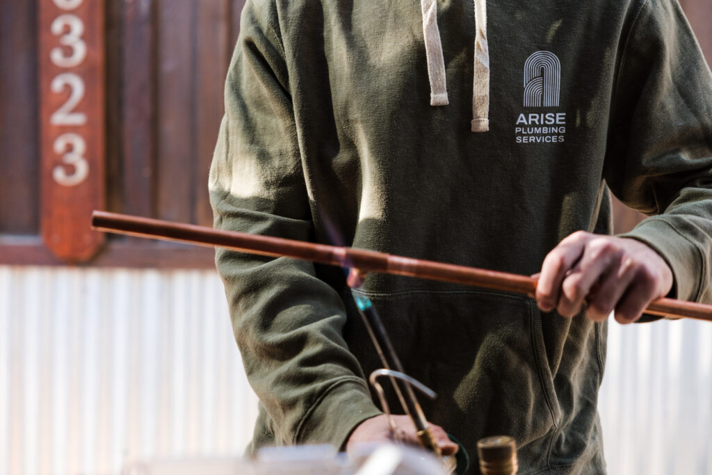 Plumber with blow torch